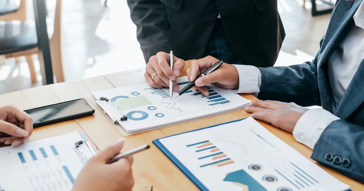 Business owners reviewing financial reports with a Calgary CPA