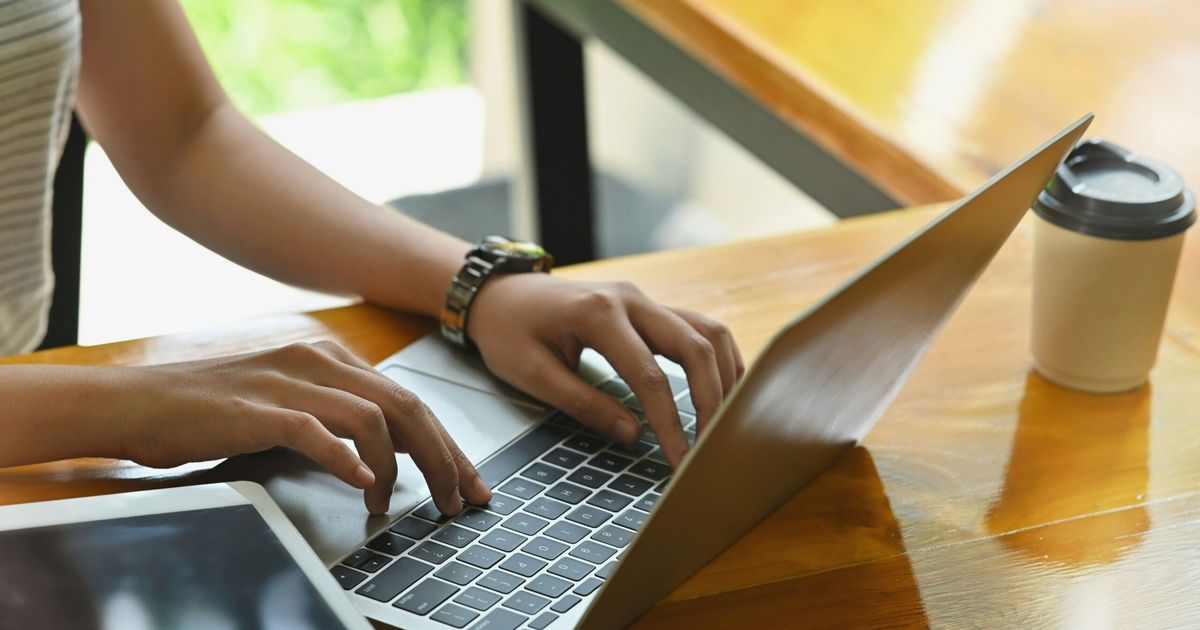 Business owner reviewing financial reports on a laptop